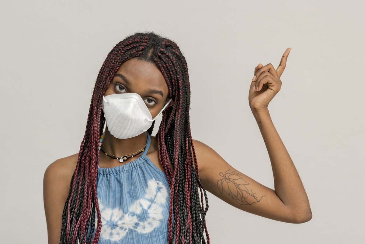 A girl wears a face mask to prevent catching coronavirus.