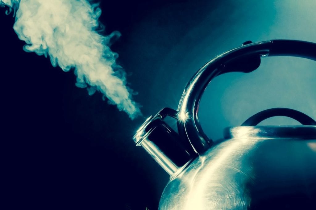 A kettle releases water vapour.