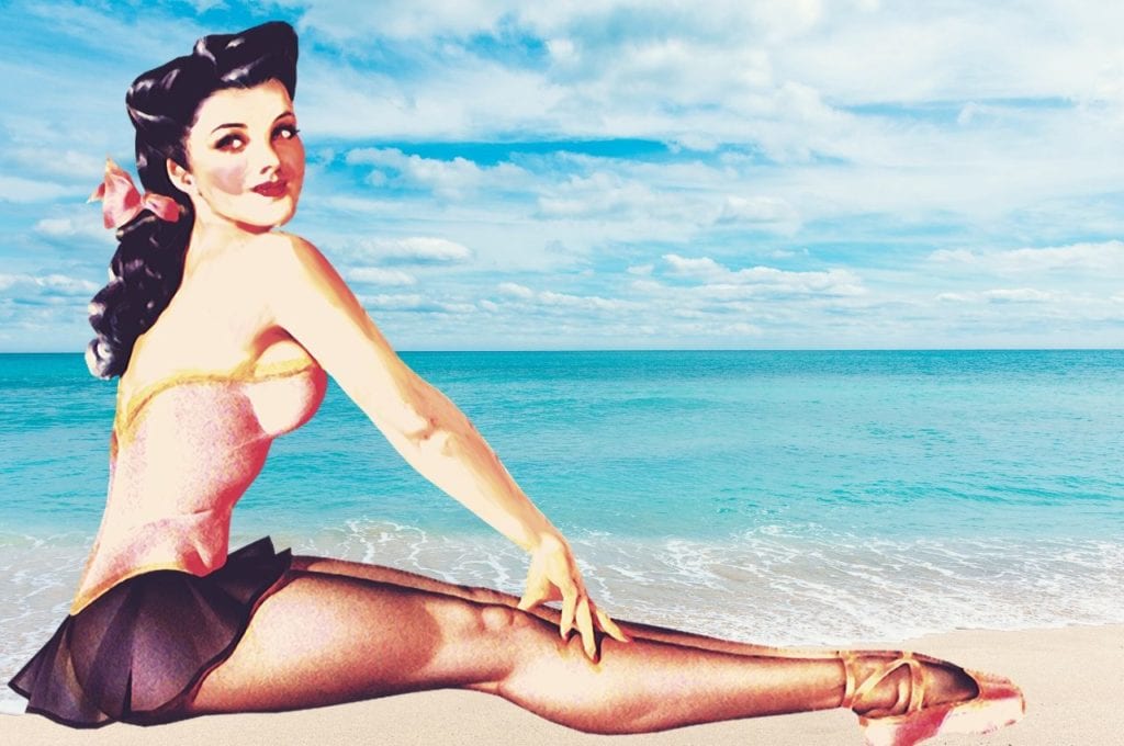 Pinup girl sitting on the beach.