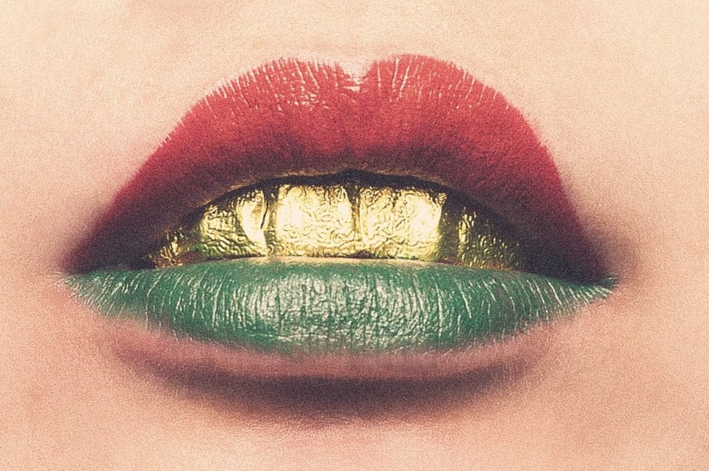 5 DIY CBD Isolate Products You Can Make At Home | Recipes | My Supply Co. Lips painted with coloured lip balm, and golden teeth.