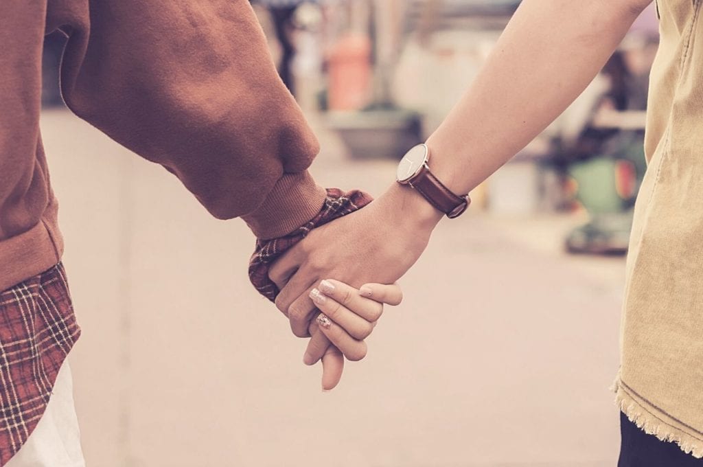 Love in the Time of Cannabis: Dating Difficulties for Cannabis Users | Sex | My Supply Co. A couple holds hands as they walk.