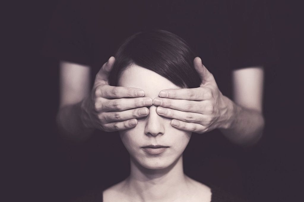 Love in the Time of Cannabis: Dating Difficulties for Cannabis Users | Sex | My Supply Co. A pair of hands cover eyes, representing a blind date.