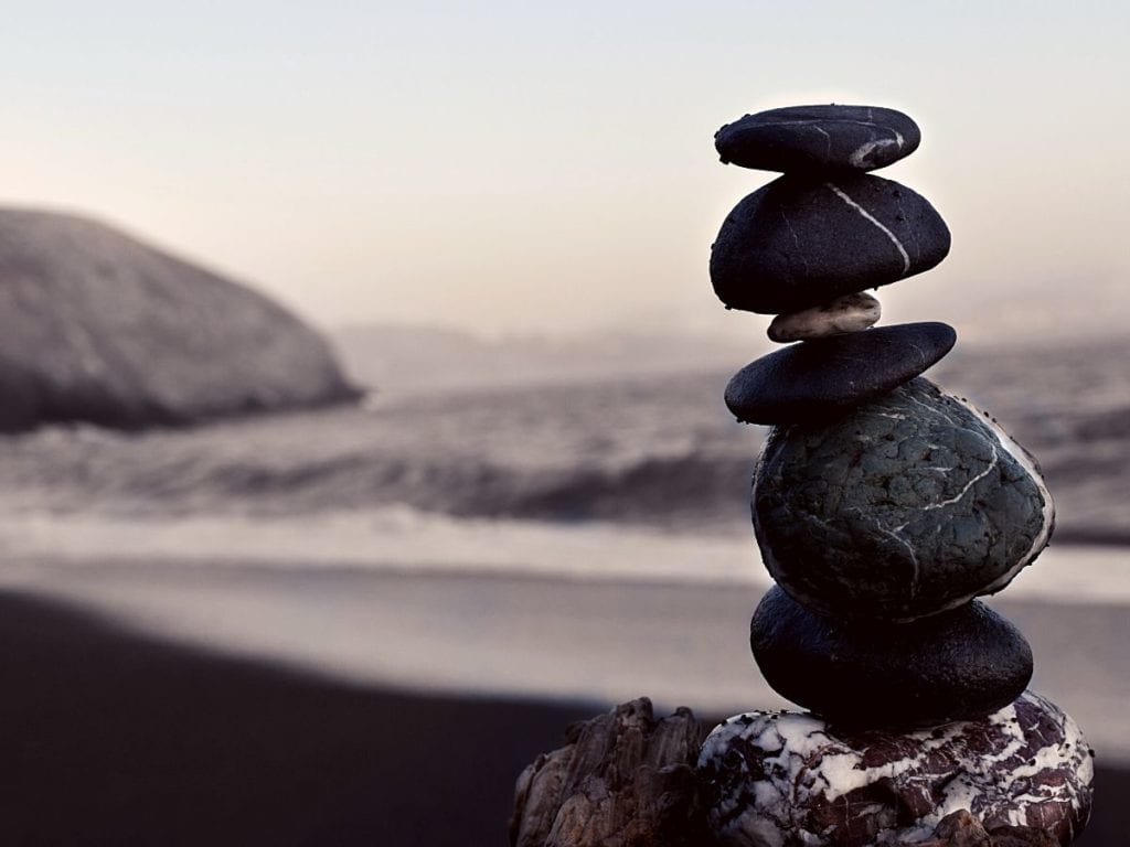 Balance rocks against th background of crashing waves.