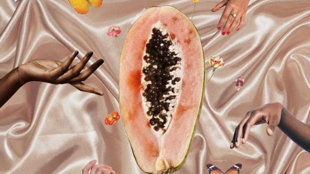 A conceptual image of the female reproductive system including a papaya and hands