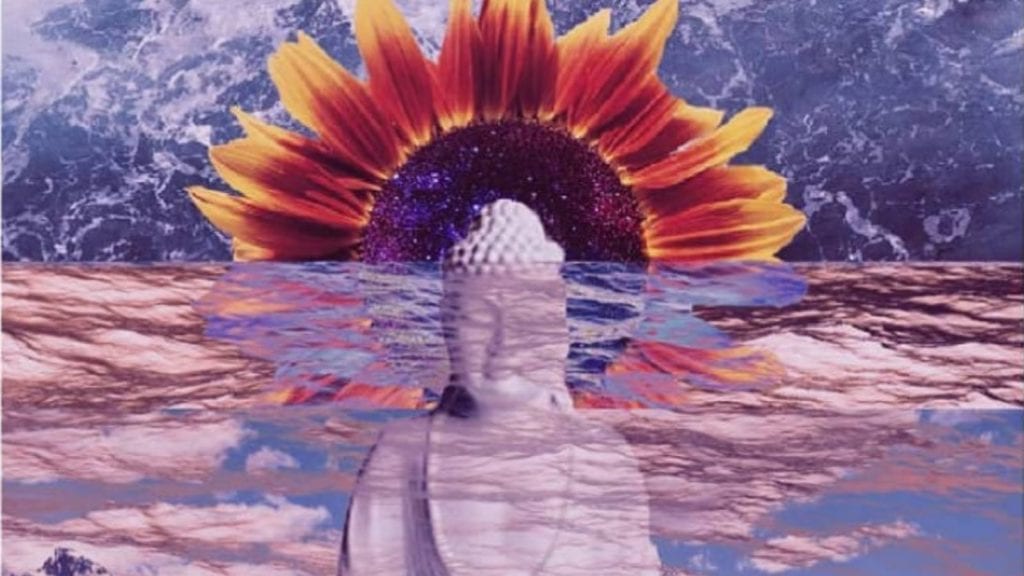 A buddha sits in the ocean with a sunflower around his head