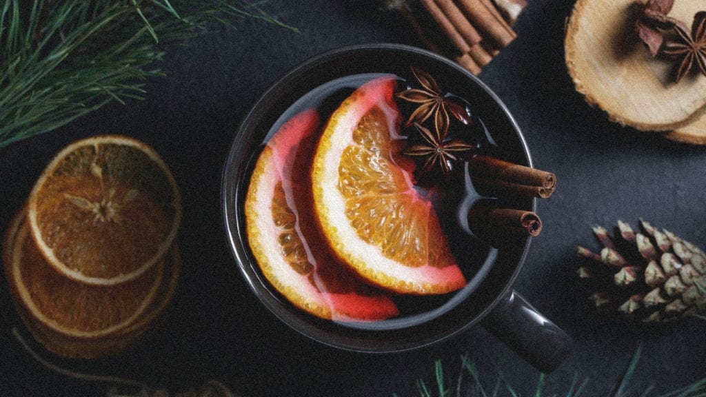 5 Cannabis-Infused Winter Warming Beverage Recipes | Recipes | My Supply Co. A mug of mulled wine filled with oranges, star anise and cinnamon.