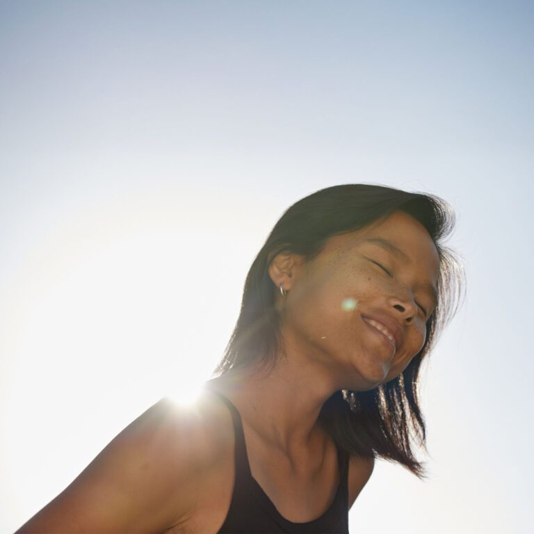 Happy Woman for Article About Safety of Mixing Psilocybin and MDMA