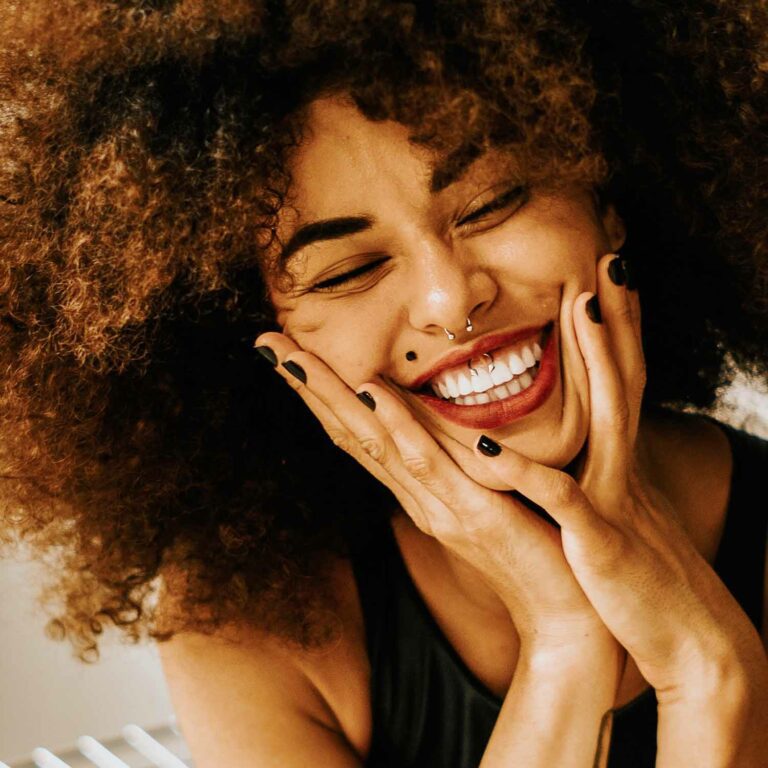 Image of Smiling Woman for article on Is it Safe to Mix Magic Mushrooms With Antidepressants?