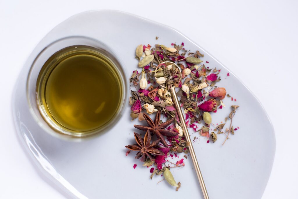 A photograph of tea for treating grief-motivated anxiety made with CBD, anise, and rose petals for an article with 3 CBD tisane recipes for soothing your anxiety