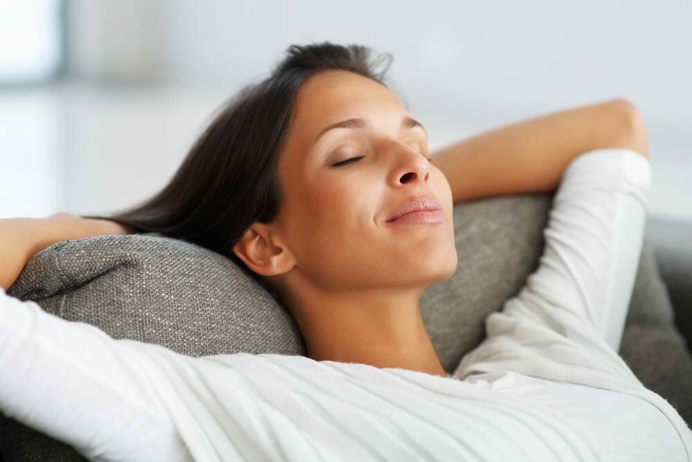 How to Make Shroom Tea: The Ultimate Mushroom Tea Guide | Living | My Supply Co. Image of woman relaxing and free of nausea for our guide on how to make magic mu